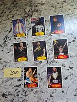 Eight WWF trading cards laid out on countertop