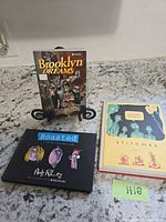 All three books standing and lying on countertop