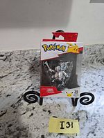 Front view of sealed Pokémon 25th Anniversary Silver Cubone figure box