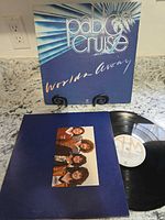 Front cover of Worlds Away LP on stand with record and inner sleeve visible