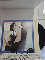 Front cover of Pat Benatar vinyl LP with record partially visible