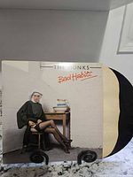 Front view of jacket showing title, inner sleeve partially removed, vinyl visible