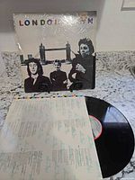 Front cover of London Town album with vinyl partially removed