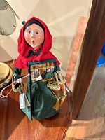 Full view of caroler showing clothing, accessories, and scale