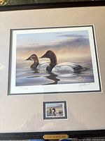 Front view of framed print showing artwork, edition number, artist signature, mounted stamp and title plate