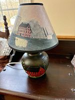 Full lamp showing painted resin base and printed fabric shade