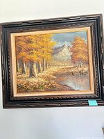 Framed oil on canvas landscape front view