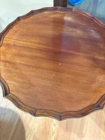 top view showing scalloped edge and wood veneer surface