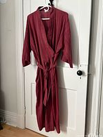 Robe hanging to show full front view and belt