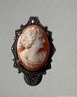 front view of sterling silver shell cameo clip