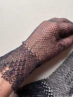 Glove on hand showing lace mesh and cuff detail