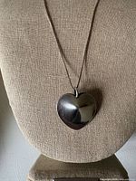 Front view of sterling heart pendant necklace on display
