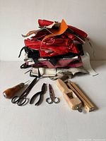 Stack of leather remnants with tools laid out
