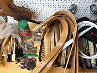 overview of wood pieces, violin form, jars, hooks, copper wire rolls