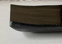 side view showing curved underside and polished stone