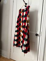 Full front view of sleeveless A-line Marimekko dress on hanger