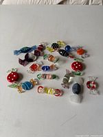 Group shot of all Murano glass candies on white surface