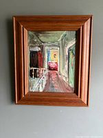 Front view of framed oil painting