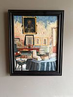 Frontal view of framed oil painting on wall