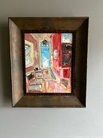 Full view of framed oil painting on wall