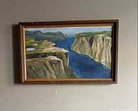 Full view of framed oil painting on wall