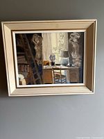 Framed oil painting on wall showing full view