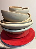 Full view of stacked bowls on red base