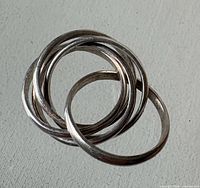 Top view of six interlocking sterling bands