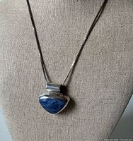 Front view of necklace on display bust showing sodalite pendant and chain