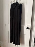 Full view of both hanging pants, Lululemon front, Bluenotes behind