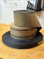 Stacked rolls showing three different webbings