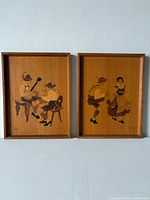 Both marquetry plaques side by side