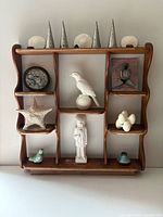 full view of wood shelf with all decorative objects displayed