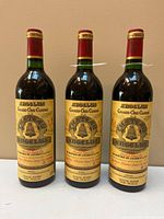 Front view three bottles showing labels and fill levels