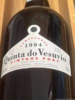 Close-up of bottle label showing vintage year, brand, and capacity