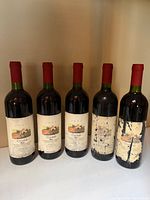 Five Torrebella Montepulciano d'Abruzzo bottles showing varying label wear