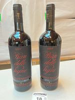 Front view of both 1998 Antinori Pian delle Vigne bottles standing upright