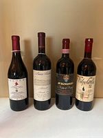 Front view of all four wine bottles