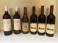 Front view of all six wine bottles showing labels and quantity