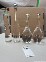 Front view of five Alexander grappa bottles