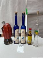 Group shot of all five bottles standing