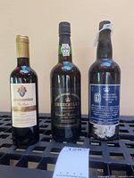 Front view of three wine/port bottles