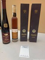 Front view of three visible bottles and two Pillitteri boxes