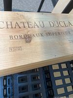 Top view of pine crate showing burned-in Chateau Ducla Bordeaux Superieur 2005 branding