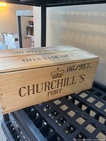 Closed pine crate with Churchill's Port branding on lid