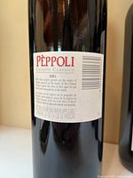 Rear label of Pèppoli bottle showing vintage and details