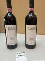 Front view of two sealed Paolo Conterno Barolo Ginestra 1995 bottles with labels visible