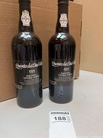 Front view of both bottles showing labels, volume, vintage.
