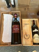 Both large-format bottles in their wooden presentation boxes