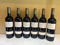 Front view of six standing bottles